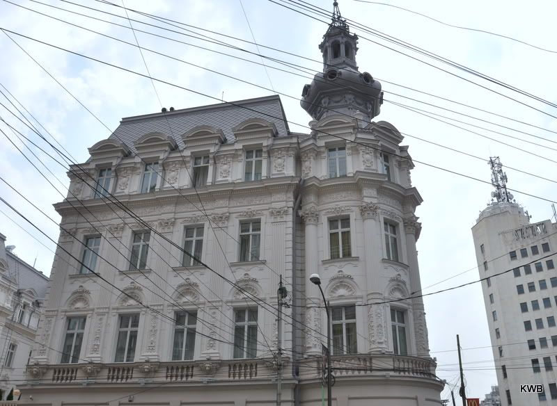 Ornate building in Bucharest with a menagerie of wires. Ornate building in Bucharest with a menagerie of wires.