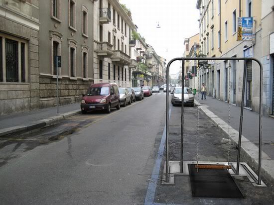 Swing set collapses into street for parking space, doubles area
